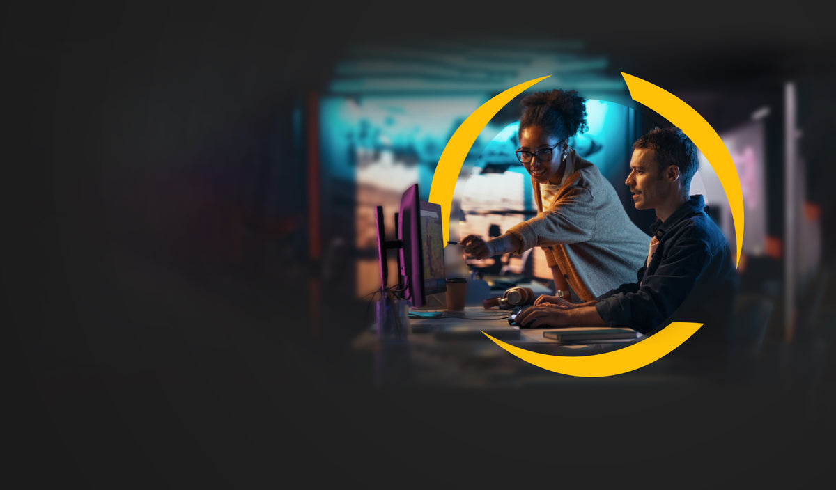 Two colleagues learning together at a computer, framed by the Gosu gold arrows.